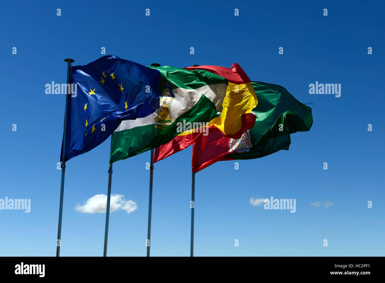 Flag flags EU Andalusia Spain Granada Torre de la Vela flutter fly flying wind blue sky administration RM World Stock Photo