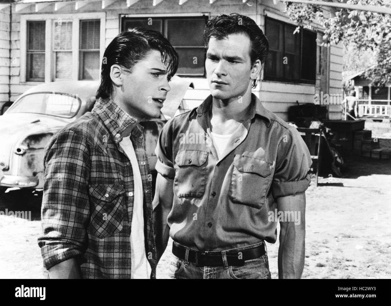 THE OUTSIDERS, from left, Rob Lowe, Patrick Swayze, 1983, ©Warner Bros ...