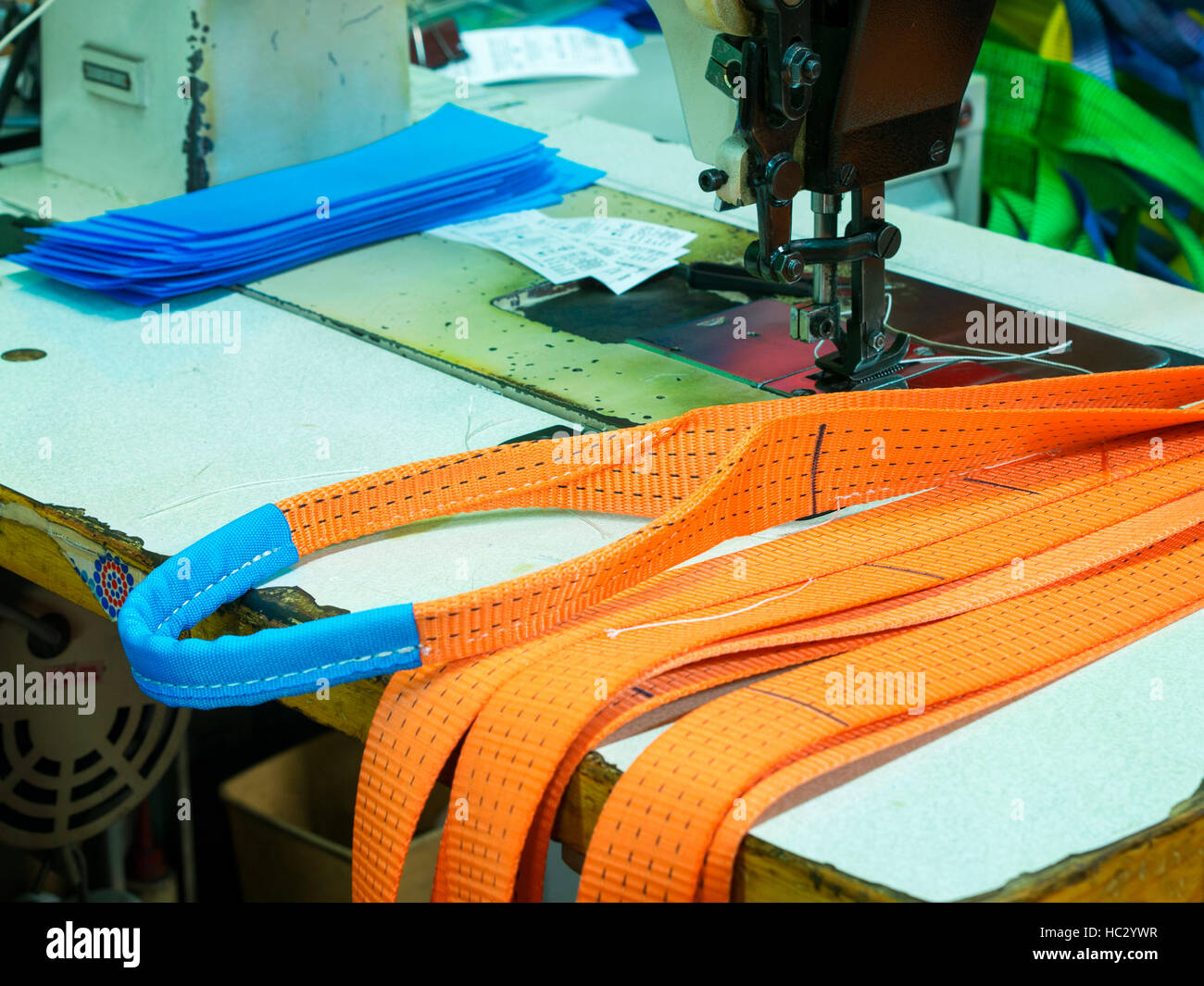 Industrial sewing machine sews a ratchet strap Stock Photo Alamy