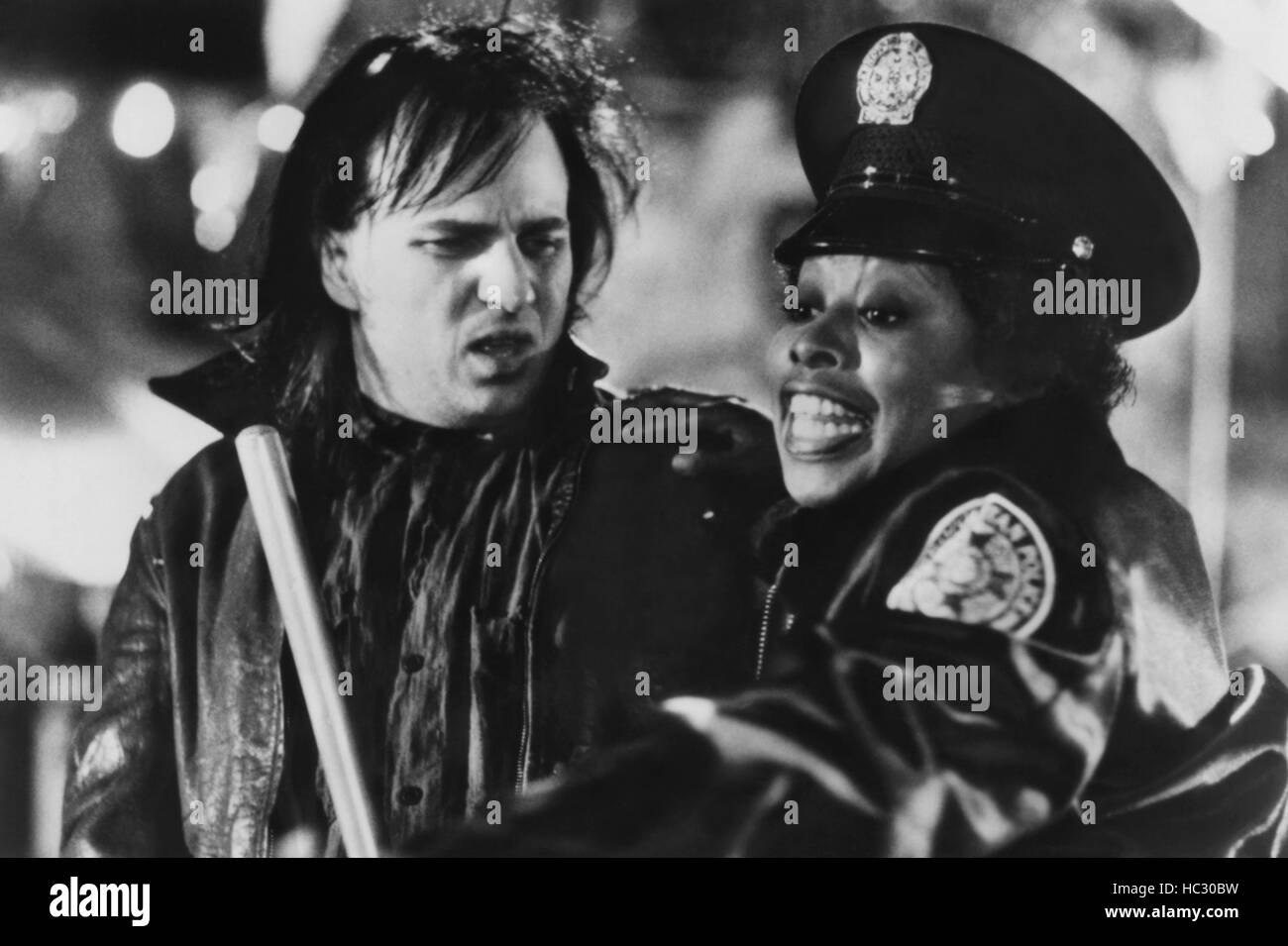 POLICE ACADEMY II: Their First Assignment, Bobcat Goldthwait, Marion Ramsey, 1985, (c)Warner Bros./courtesy Everett Collection Stock Photo