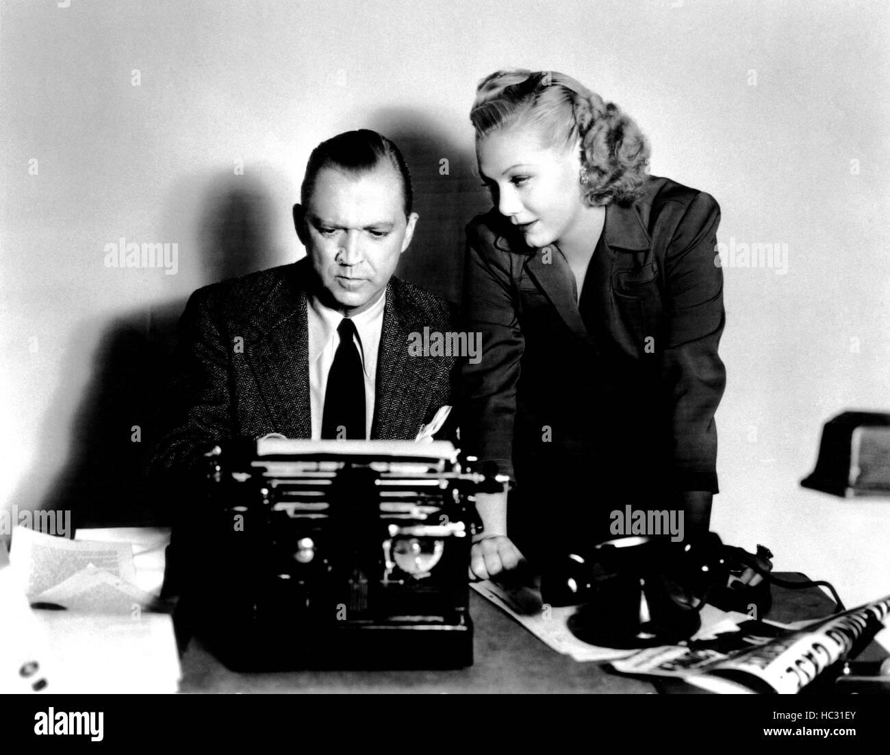 POWER OF THE PRESS, from left, Lee Tracy, Gloria Dickson, 1943 Stock