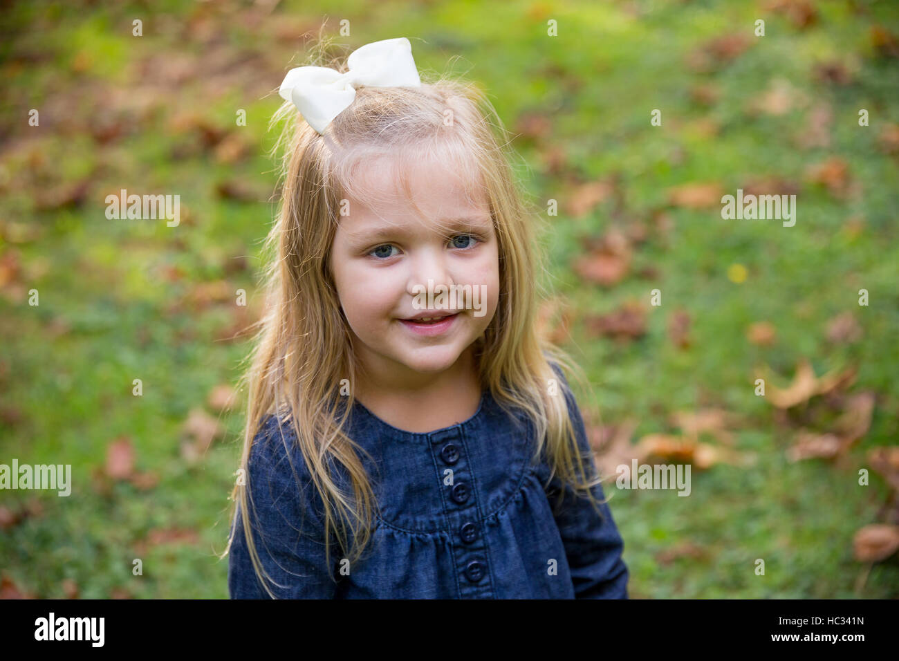 Candid lifestyle portrait of a young girl at a park. Stock Photo