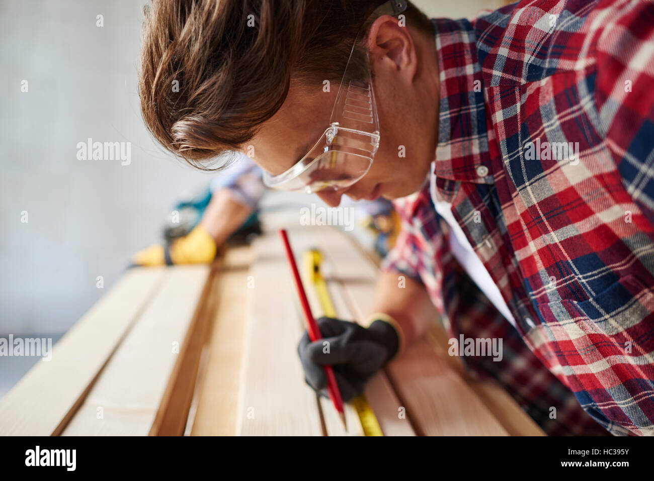 Another measurement done by building worker Stock Photo