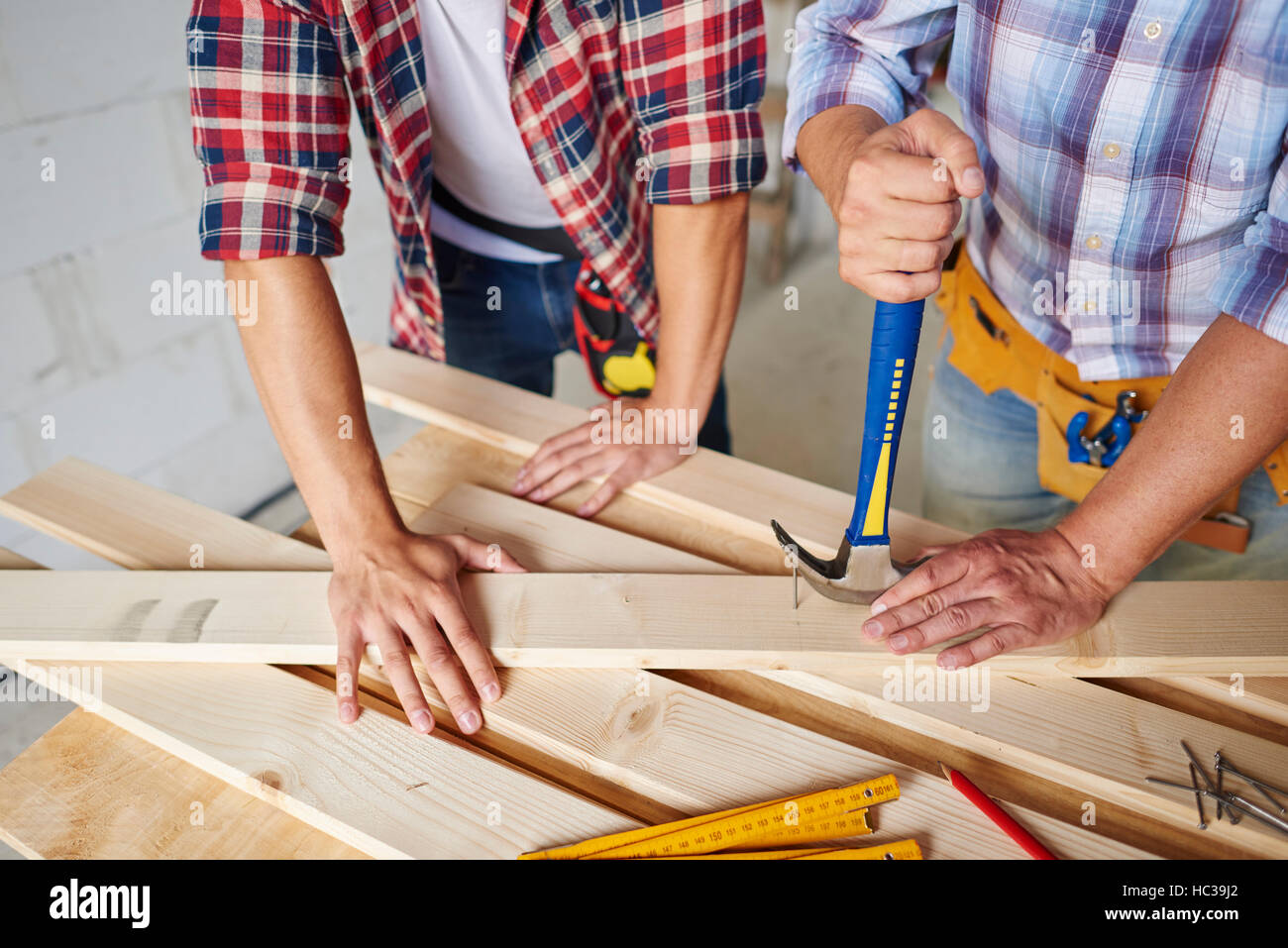 Carpenters removing nails from wood Stock Photo Alamy