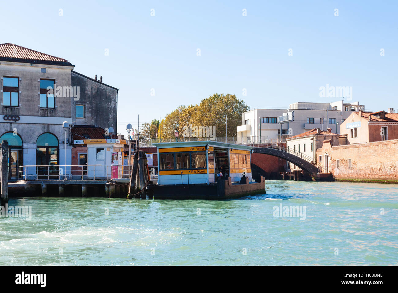 VENICE, ITALY - OCTOBER 12, 2016: Piazzale Roma vaporetto water bus stops on the Grand Canal in Venice. The square acts as the main bus station for Ve Stock Photo
