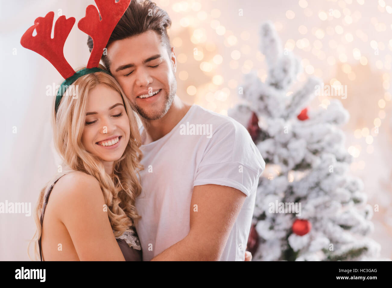 Delighted dreamy couple hugging Stock Photo