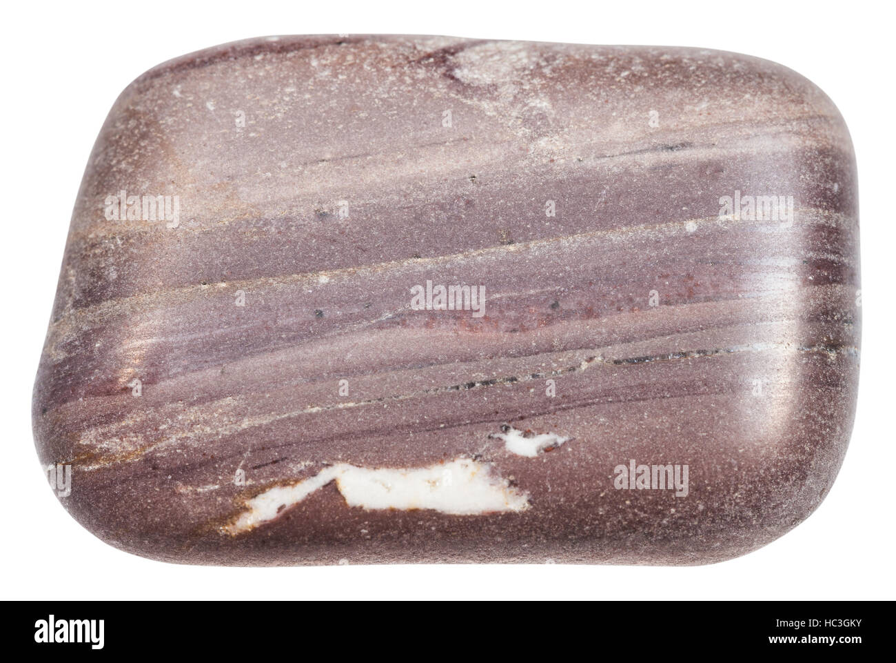 macro shooting of specimen of natural mineral - tumbled Argillite stone isolated on white background Stock Photo
