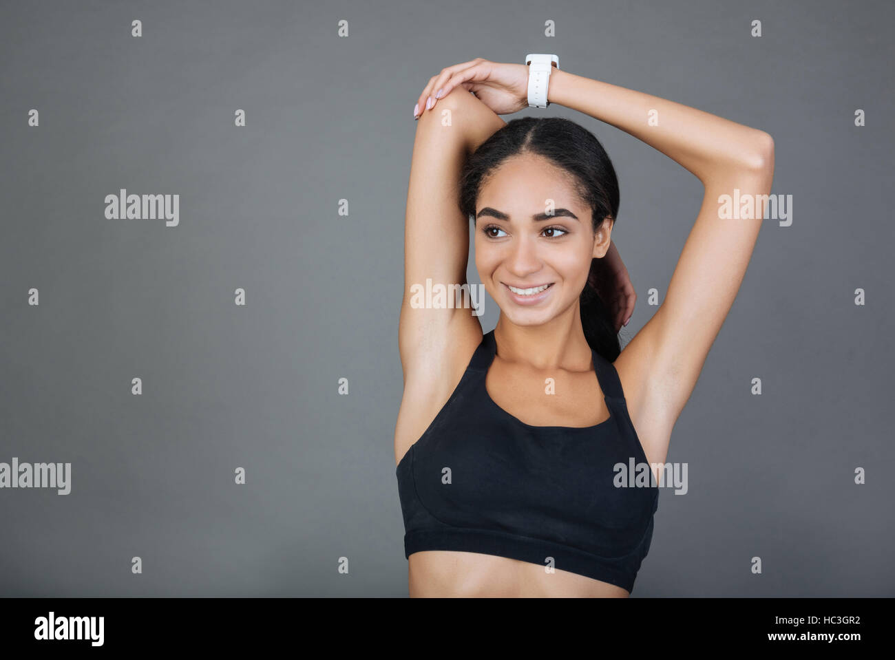 Charming girl holding muscular arms bent in elbows Stock Photo Alamy