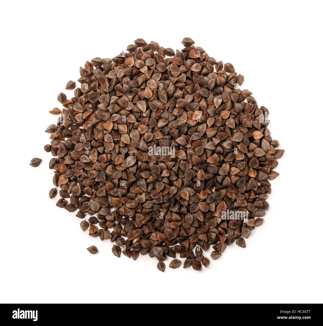 Top view of unhulled buckwheat pile isolated on white Stock Photo