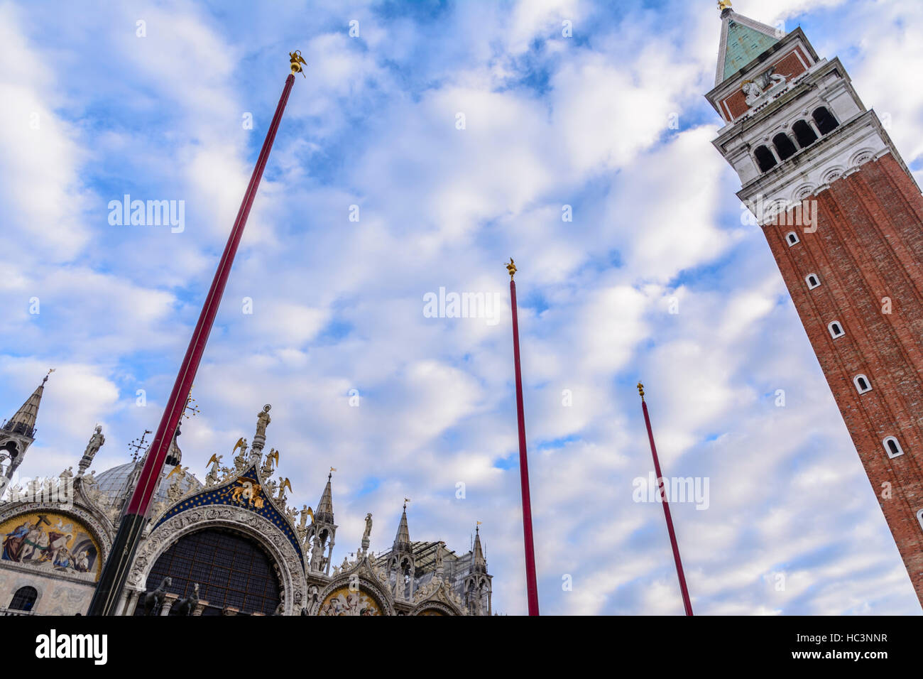 A low angle view of St. Mark's Basilica and the Campanile Tower in Venice, Italy Stock Photo