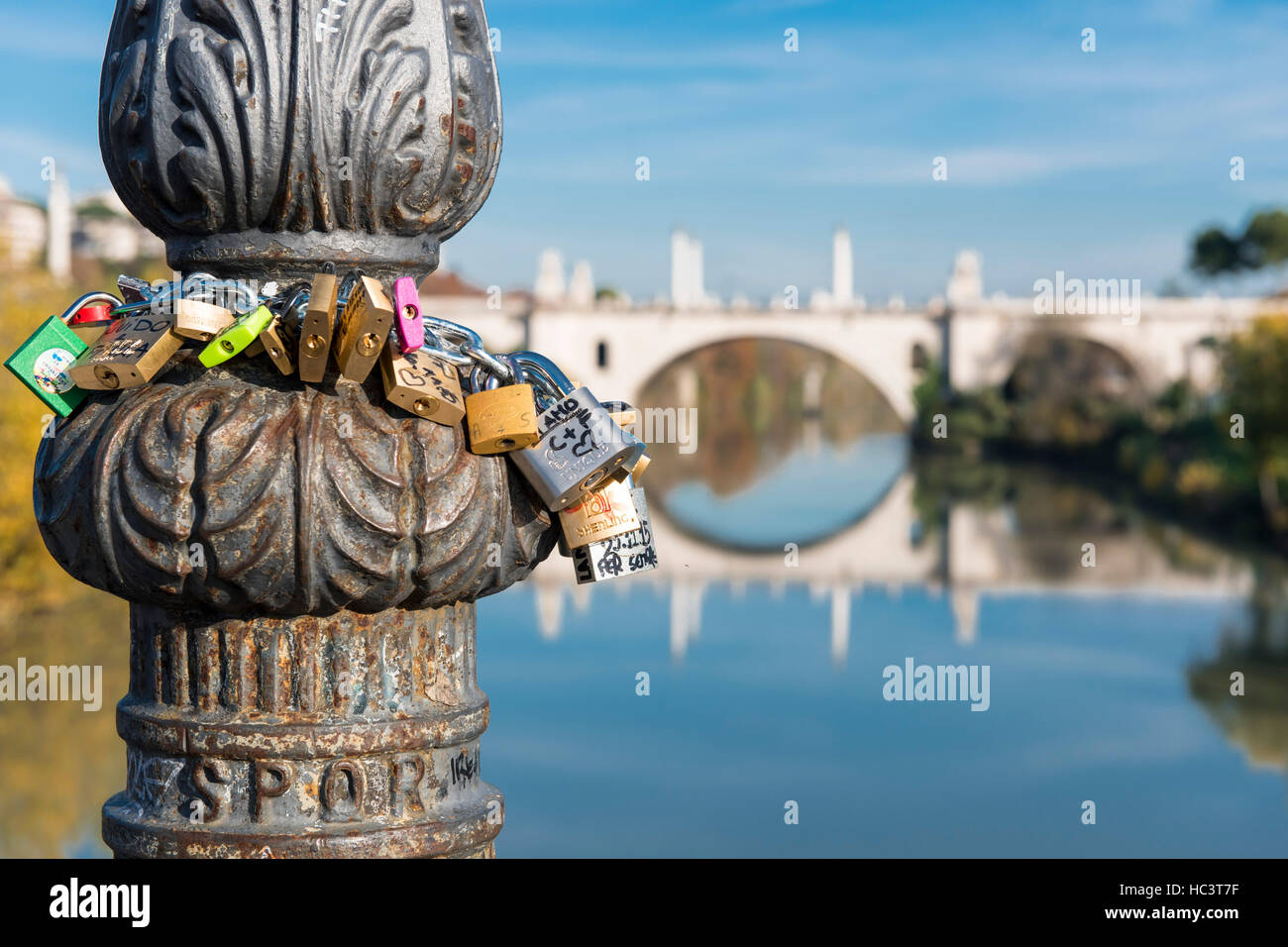 Rome (Italy) - Padlocks on Milvio Bridge, The Tiber river and the Flaminio Bridge Stock Photo