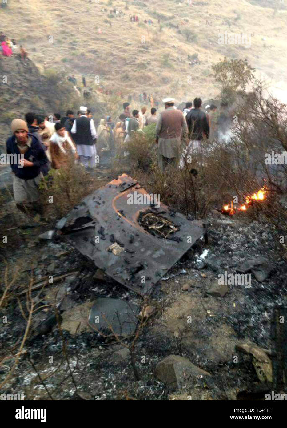 Havelian, Pakistan. 7th December, 2016. locals gathering at a plane crash site in Pakistan's Havelian. Rescue work is underway after a passenger plane of Pakistan International Airlines (PIA) with 47 people on board crashed in the country's northern Havelian area on Wednesday, officials said. (Xinhua/Stringer) (sxk) Credit:  Xinhua/Alamy Live News Stock Photo