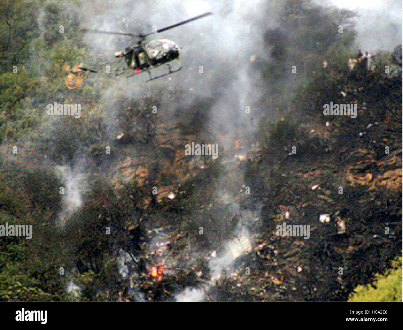 Havelian, Pakistan. 7th December, 2016. Photo taken on Dec. 7, 2016, shows a helicopter flying over the site of a plane crash in northwest Pakistan's Havelian. A passenger plane of Pakistan International Airlines (PIA) with 47 people onboard crashed in the country's northwest Havelian area on Wednesday, officials said. (Xinhua/Stringer) (sxk) Credit:  Xinhua/Alamy Live News Stock Photo
