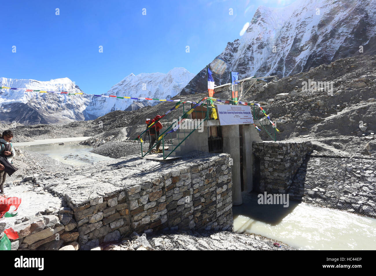Solukhumbu, Nepal. 23rd Nov, 2016. Photo taken on Nov. 23, 2016 shows shows the channel gate constructed to lower the Imja lake in the Everest region of Solukhumbu, northern part of Nepal. Imja Lake, one of the biggest and most dangerous glacial lakes in the Himalayan country, is located at an altitude of 5010 meters above sea level. Community Based Flood and Glacial Lake Outburst Risk Reduction Project at Imja was completed recently under Nepal's Department of Hydrology and Meteorology and Nepal Army and has been funded by United Nations Development Fund.According to research, the lake Stock Photo