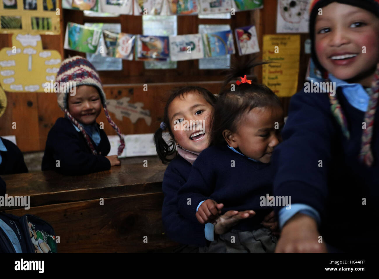 Solukhumbu, Nepal. 8th Dec, 2016. Photo taken on Nov. 17, 2016 shows local kids smile in the primary school at Ghat in the Everest region of Solukhumbu, northern part of Nepal. Imja Lake, one of the biggest and most dangerous glacial lakes in the Himalayan country, is located at an altitude of 5010 meters above sea level. Community Based Flood and Glacial Lake Outburst Risk Reduction Project at Imja was completed recently under Nepal's Department of Hydrology and Meteorology and Nepal Army and has been funded by United Nations Development Fund.According to research, the lake has been exp Stock Photo