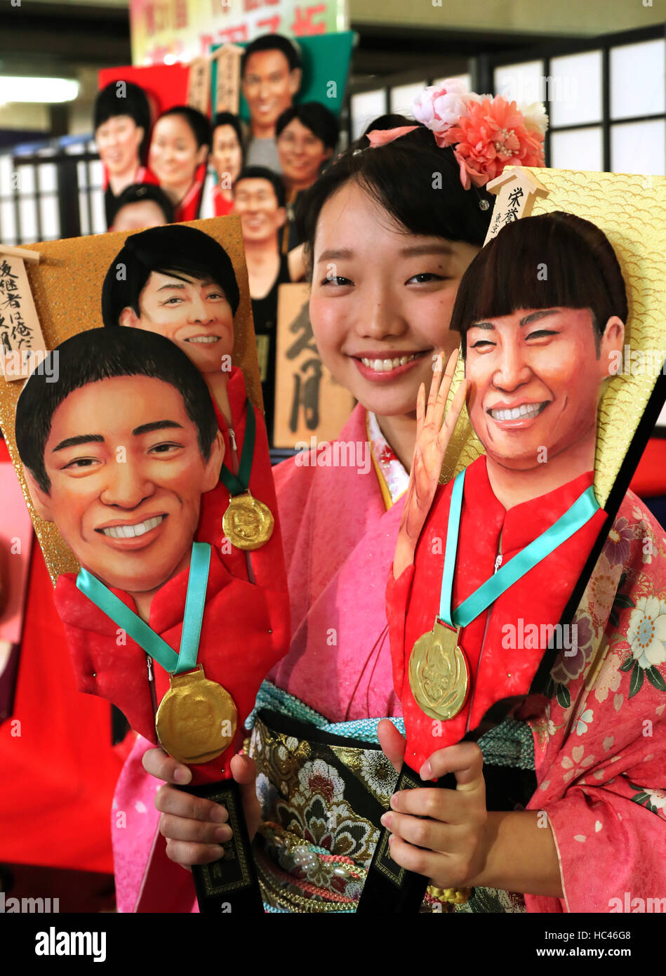 Tokyo, Japan. 7th Dec, 2016. An employee of Japanese doll maker Kyugetsu in kimono dress