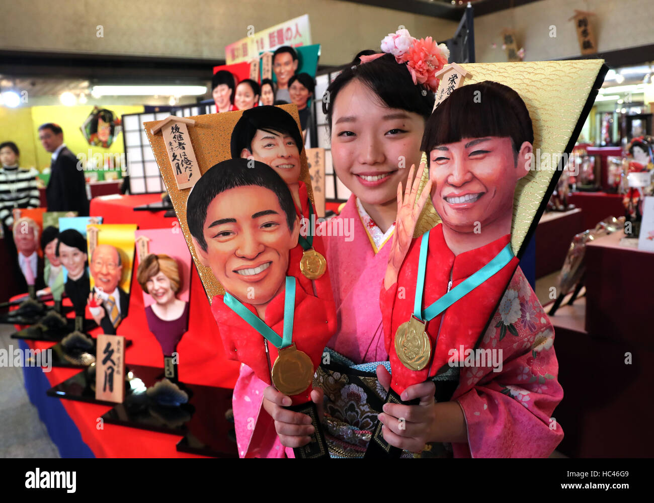 Tokyo, Japan. 7th Dec, 2016. An employee of Japanese doll maker Kyugetsu in kimono dress