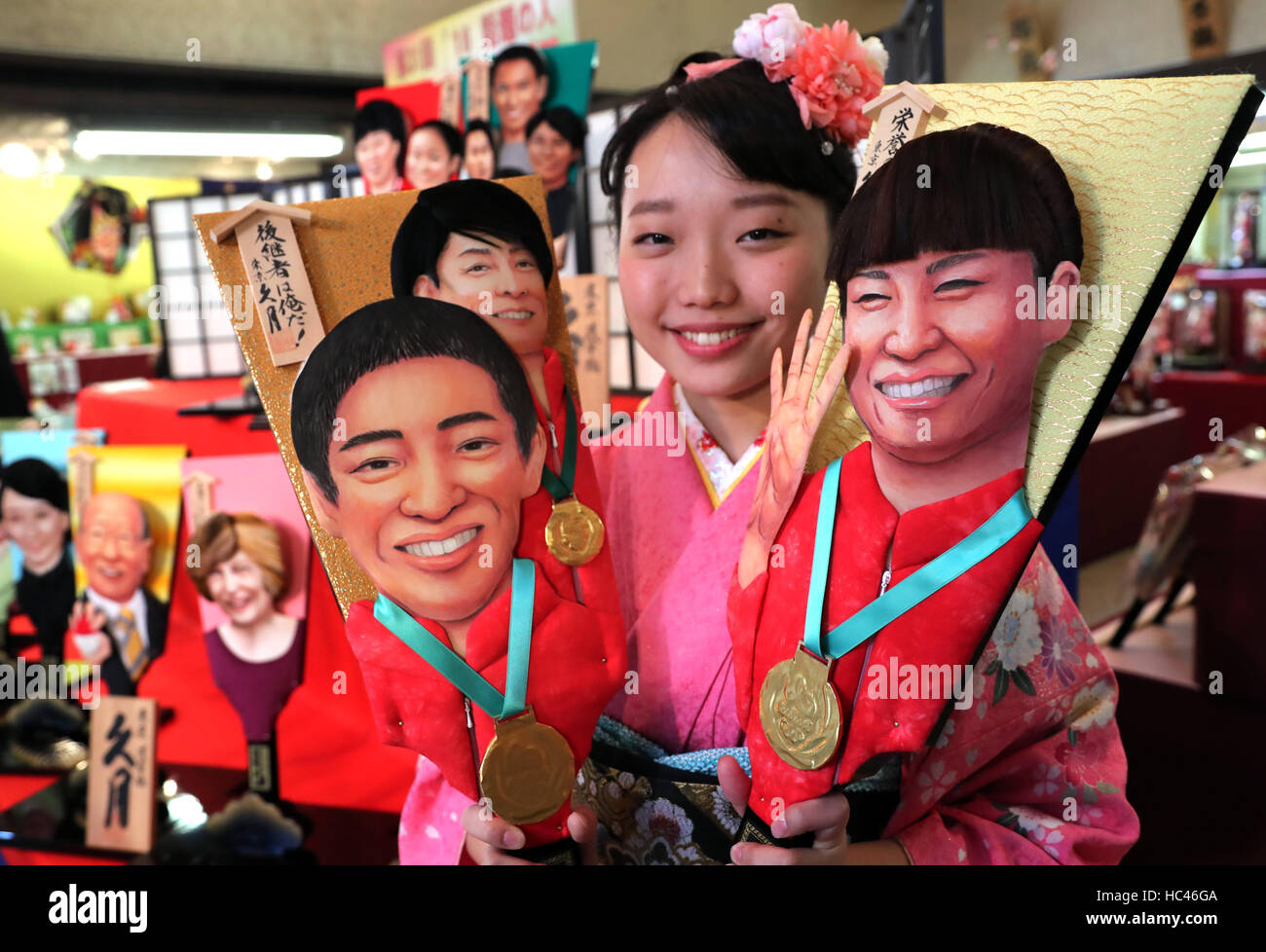 Tokyo, Japan. 7th Dec, 2016. An employee of Japanese doll maker Kyugetsu in kimono dress