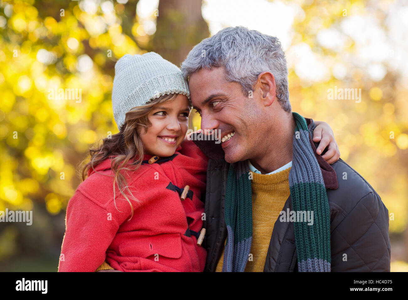 Happy father carrying daughter at park Stock Photo - Alamy
