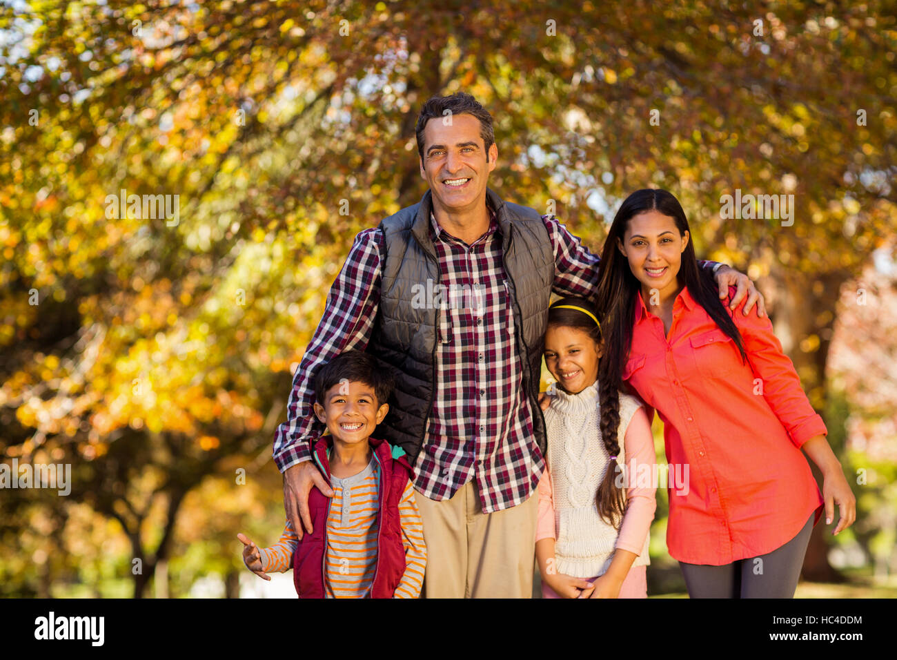 Portrait of happy family at park Stock Photo - Alamy