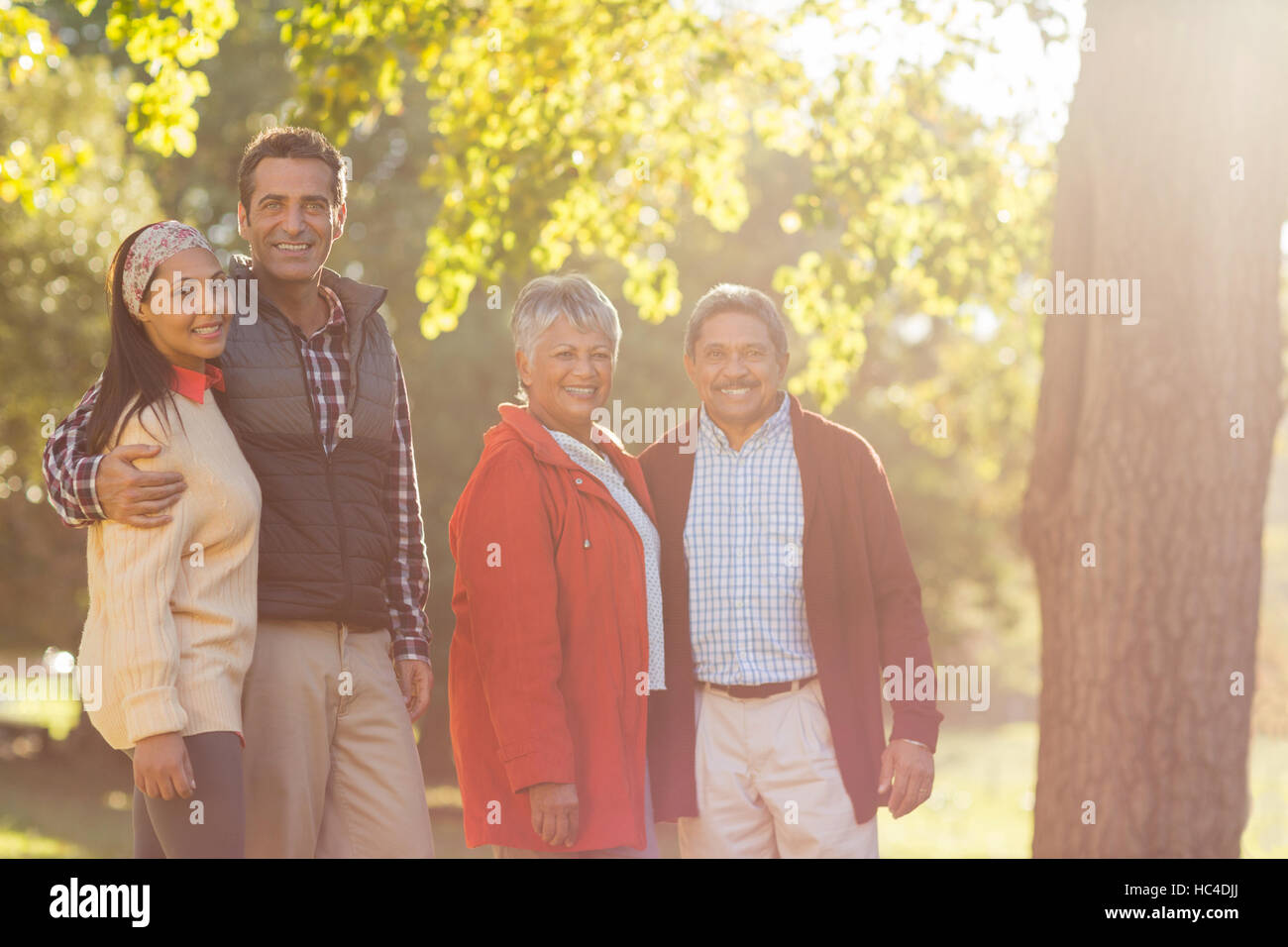 Portrait of happy family at park Stock Photo - Alamy