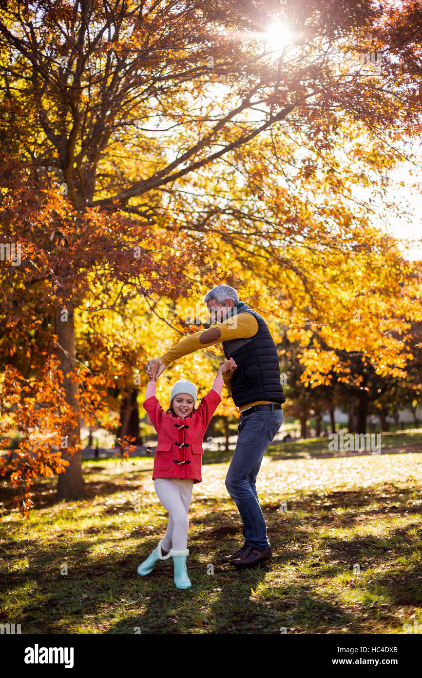 Playful father with daughter at park Stock Photo - Alamy