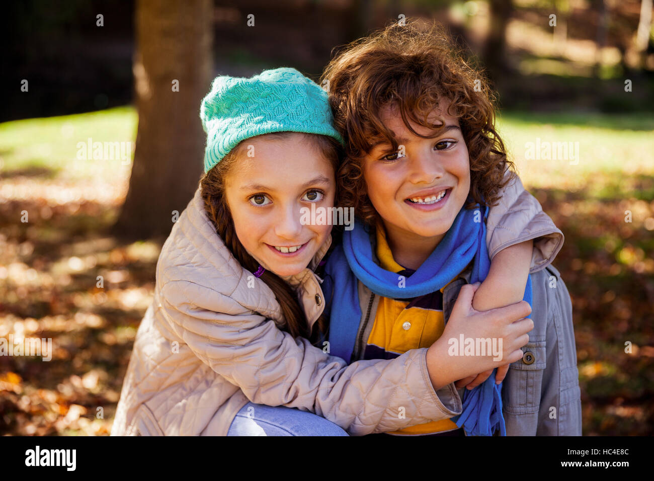 Portrait Of Sister And Brother Hugging In The Park High Resolution ...