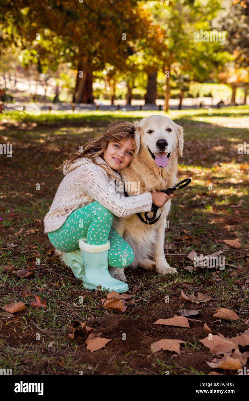 Little girl posing with her dog Stock Photo - Alamy