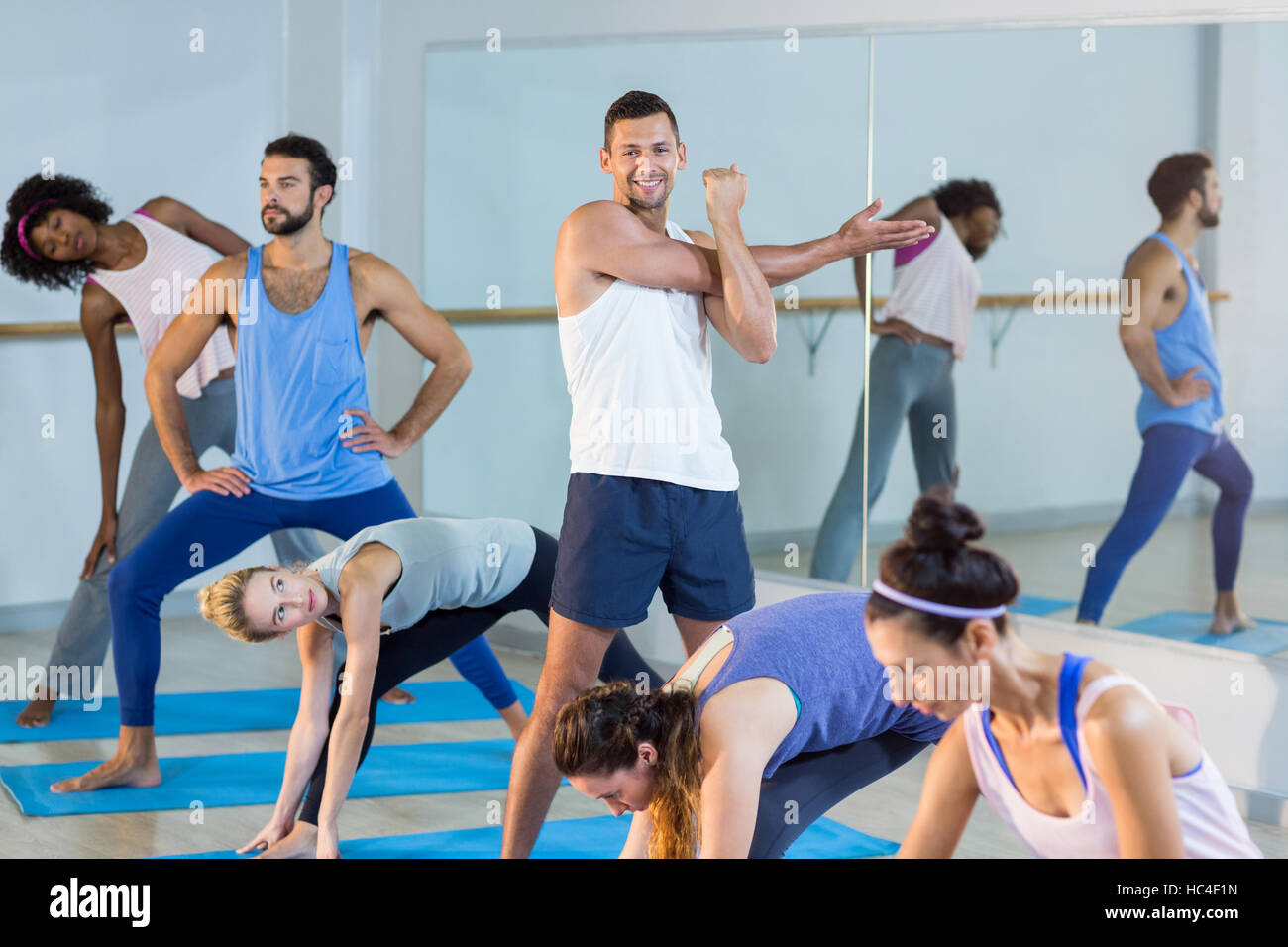 Group of people performing stretching exercise Stock Photo Alamy