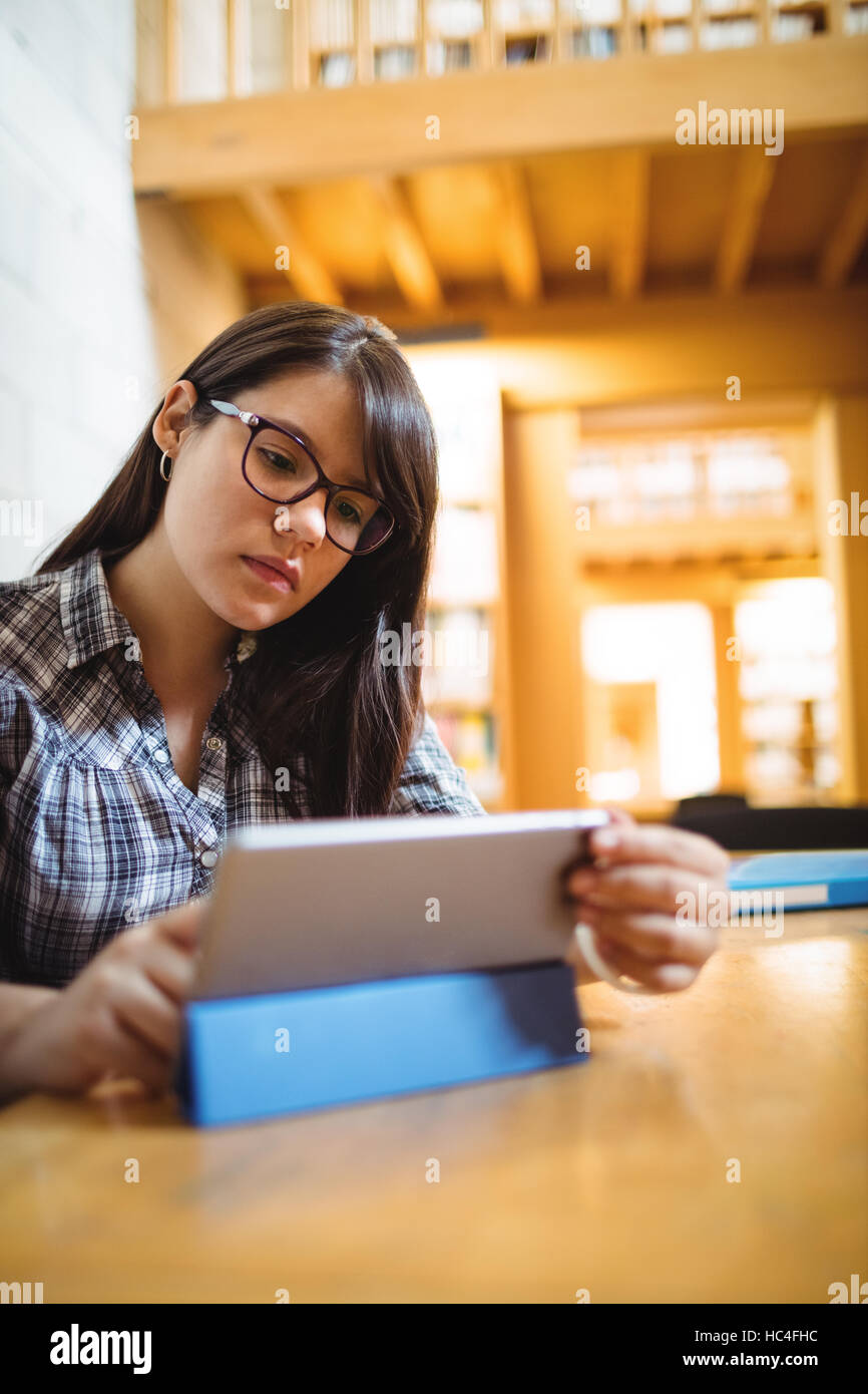 Female student using digital tablet Stock Photo