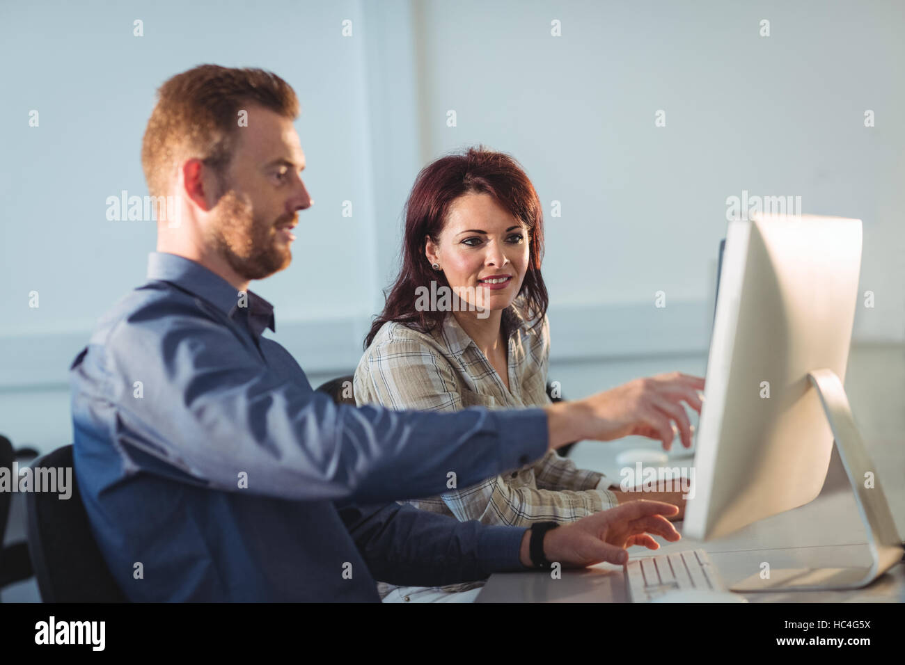 Mature students using computer Stock Photo - Alamy