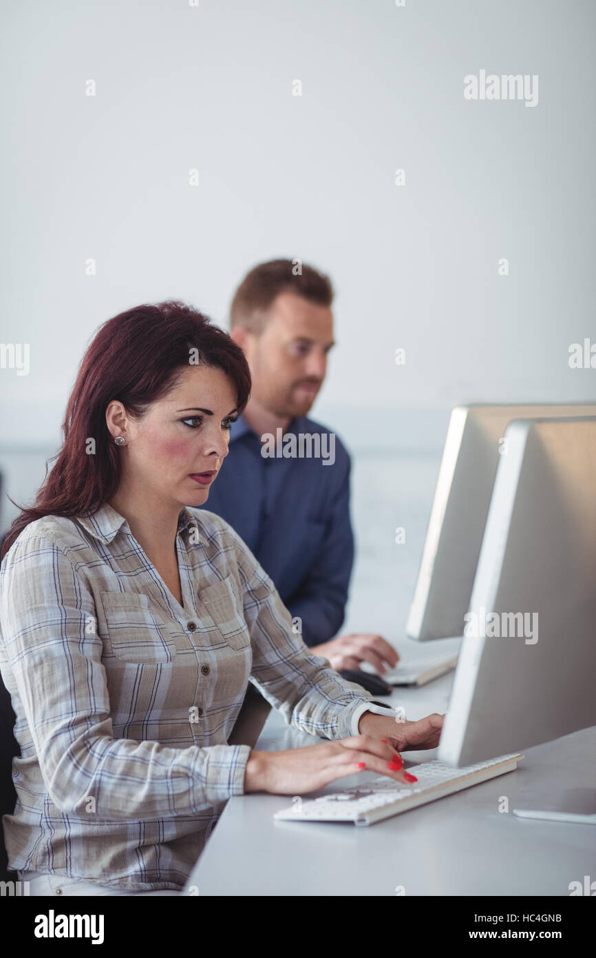 Mature students using computer Stock Photo - Alamy