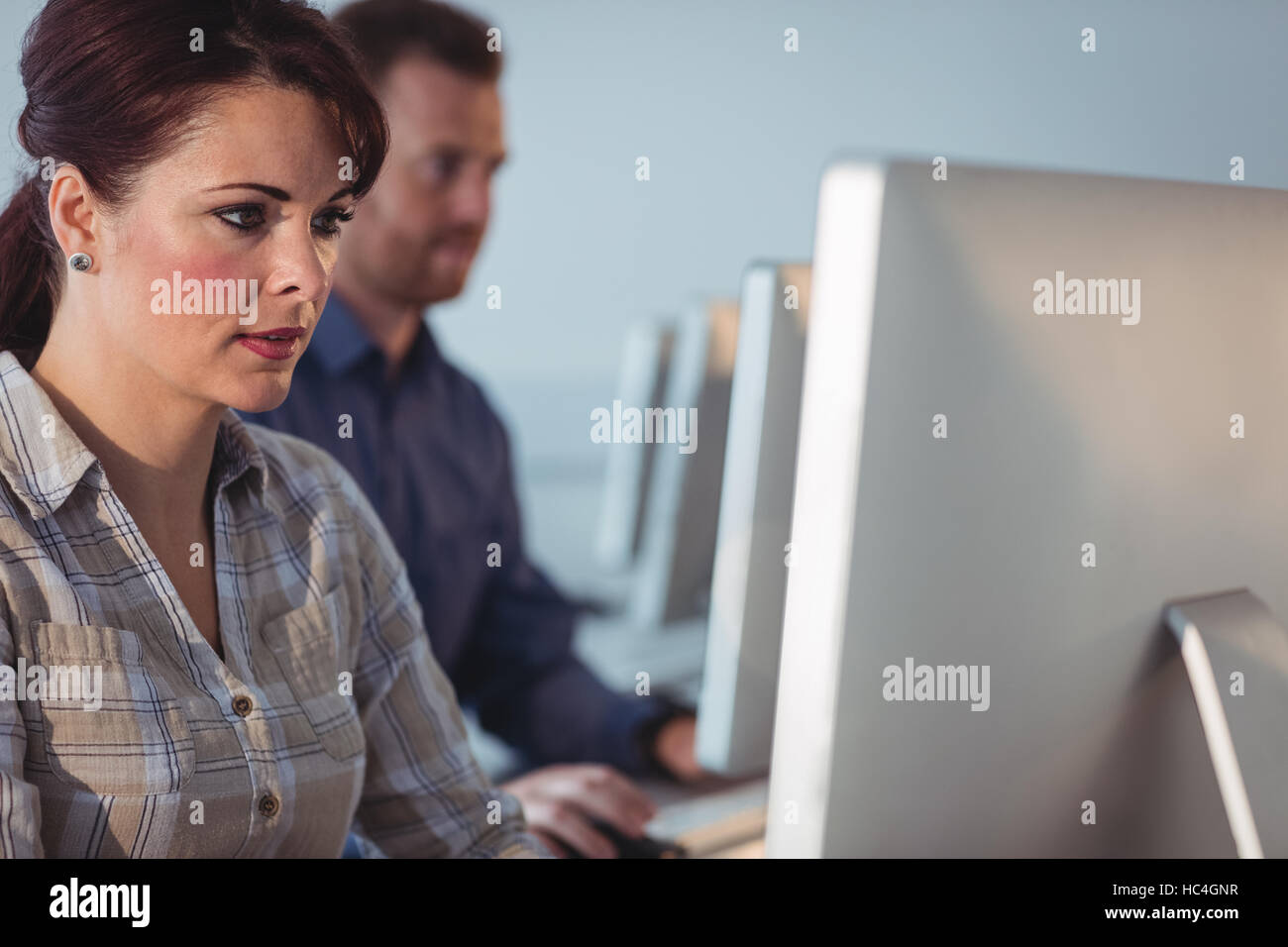 Mature students using computer Stock Photo - Alamy