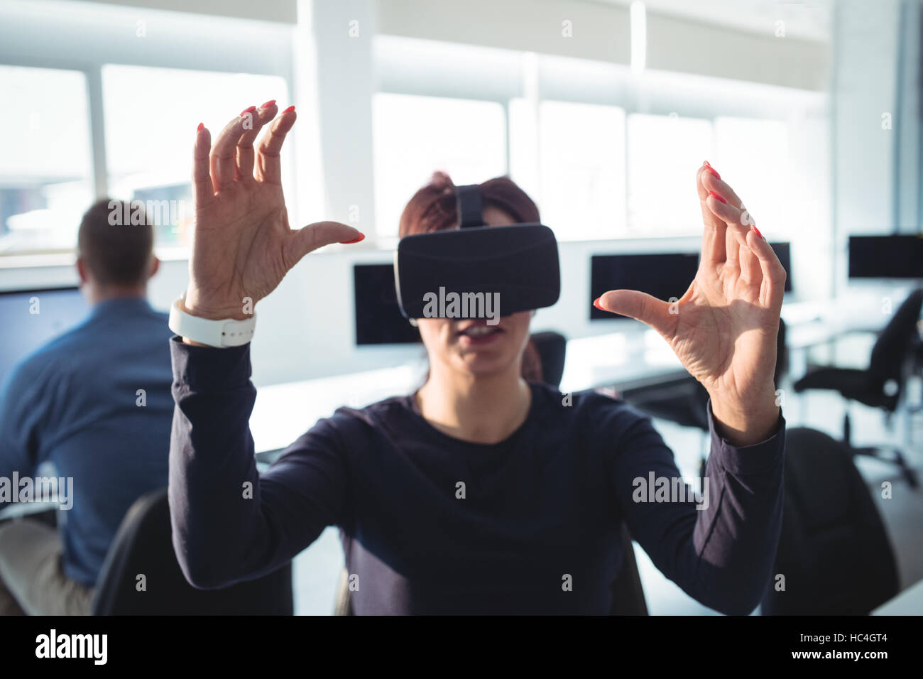 Mature student using virtual reality headset Stock Photo - Alamy