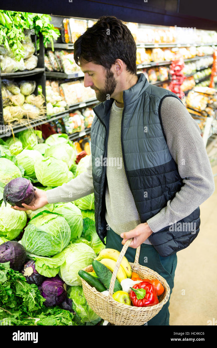 Man buying vegetables in organic shop Stock Photo