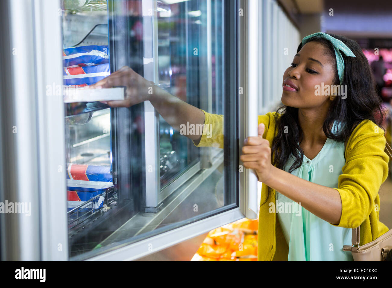 Woman shopping in grocery section Stock Photo