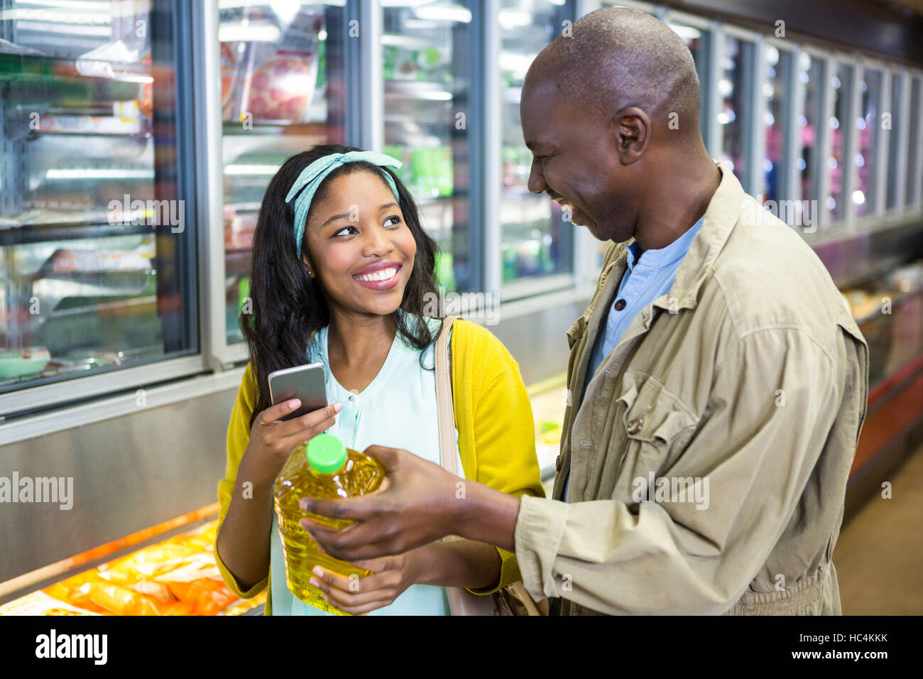 Smiling couple shopping in grocery section Stock Photo