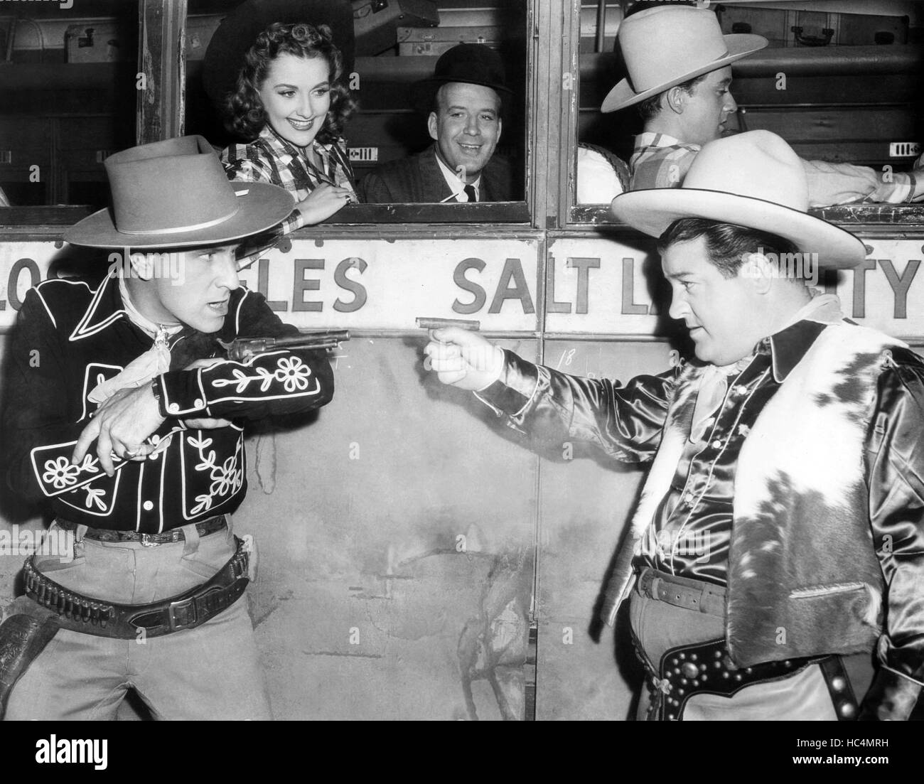 RIDE 'EM COWBOY, front from left Bud Abbott, Lou Costello, rear from