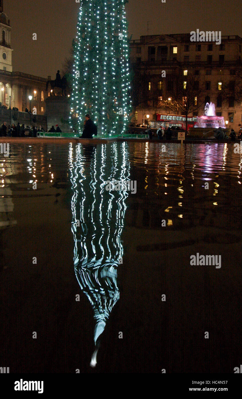 The reflection of the Christmas Tree ripples in the fountains in Trafalgar Square, central London December 16, 2016. ©John Voos Stock Photo