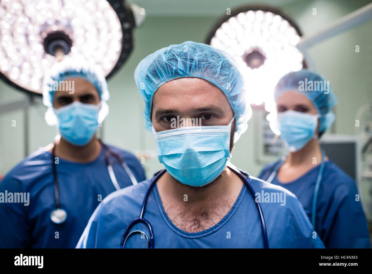 Portrait of surgeons standing in operation room Stock Photo - Alamy