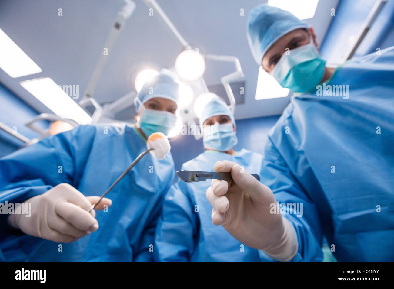 Surgeons holding surgical tools and cotton Stock Photo