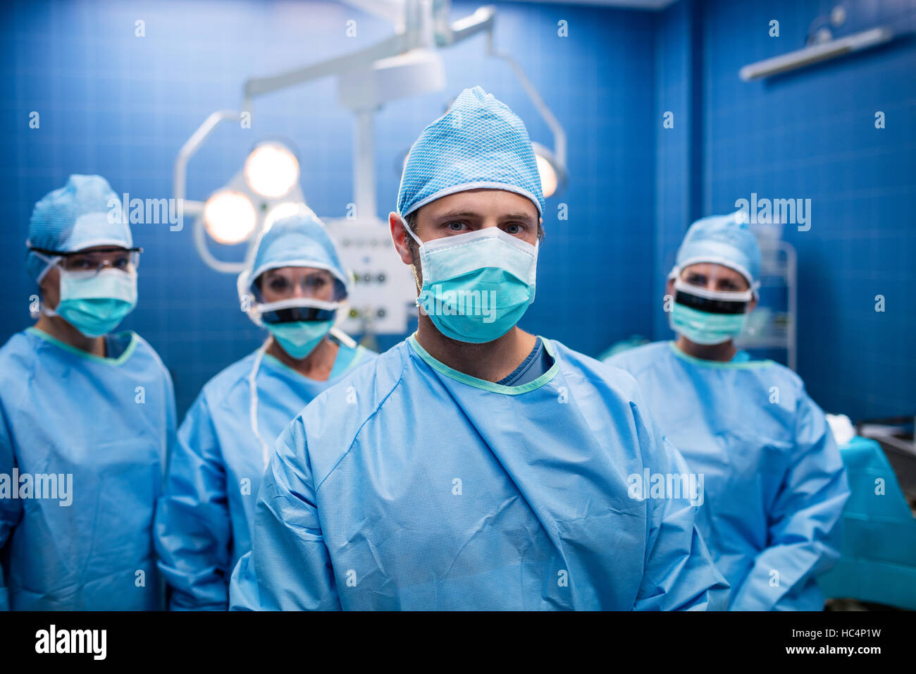 Portrait of surgeons standing in operation room Stock Photo - Alamy