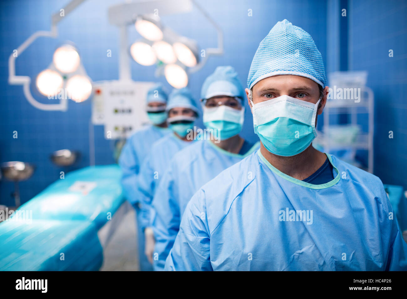 Portrait of surgeons standing in operation room Stock Photo - Alamy