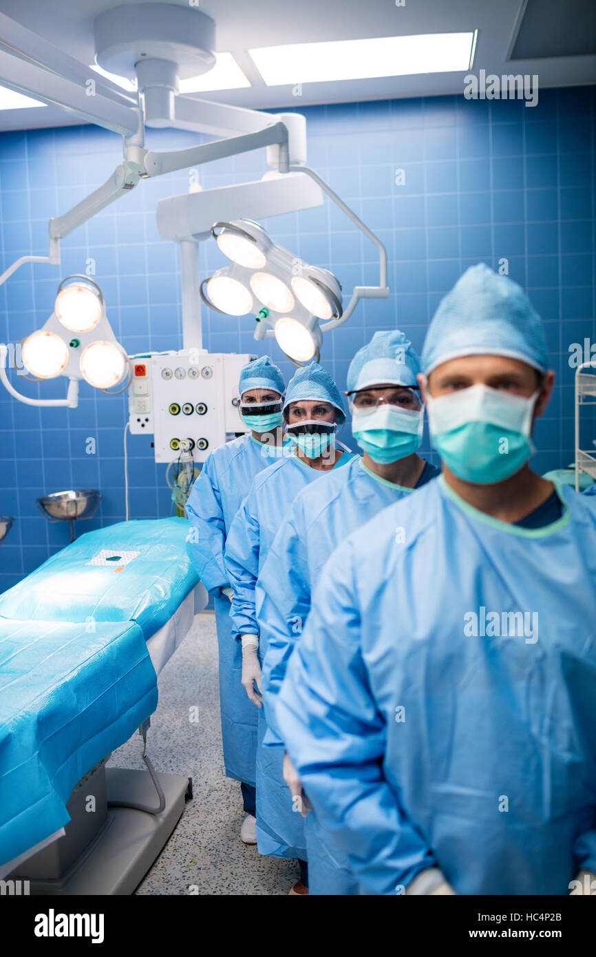 Portrait of surgeons standing in operation room Stock Photo - Alamy