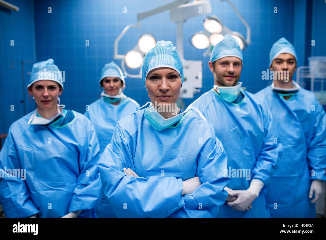 Portrait of surgeons standing in operation room Stock Photo - Alamy