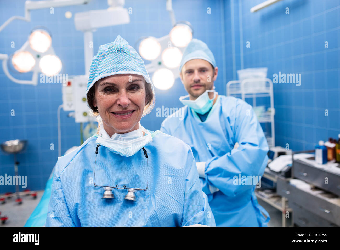Portrait of surgeons standing in operation room Stock Photo - Alamy