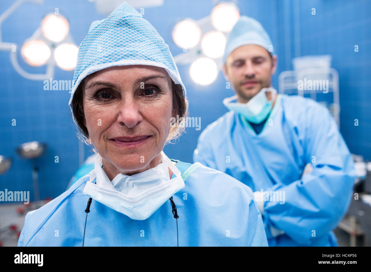 Portrait of surgeons standing in operation room Stock Photo - Alamy
