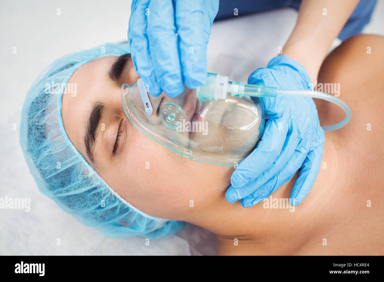 Nurse putting an oxygen mask on patient Stock Photo Alamy