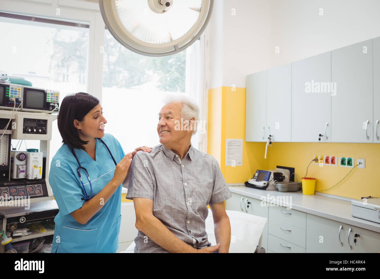 Female doctor and patient interacting with each other Stock Photo