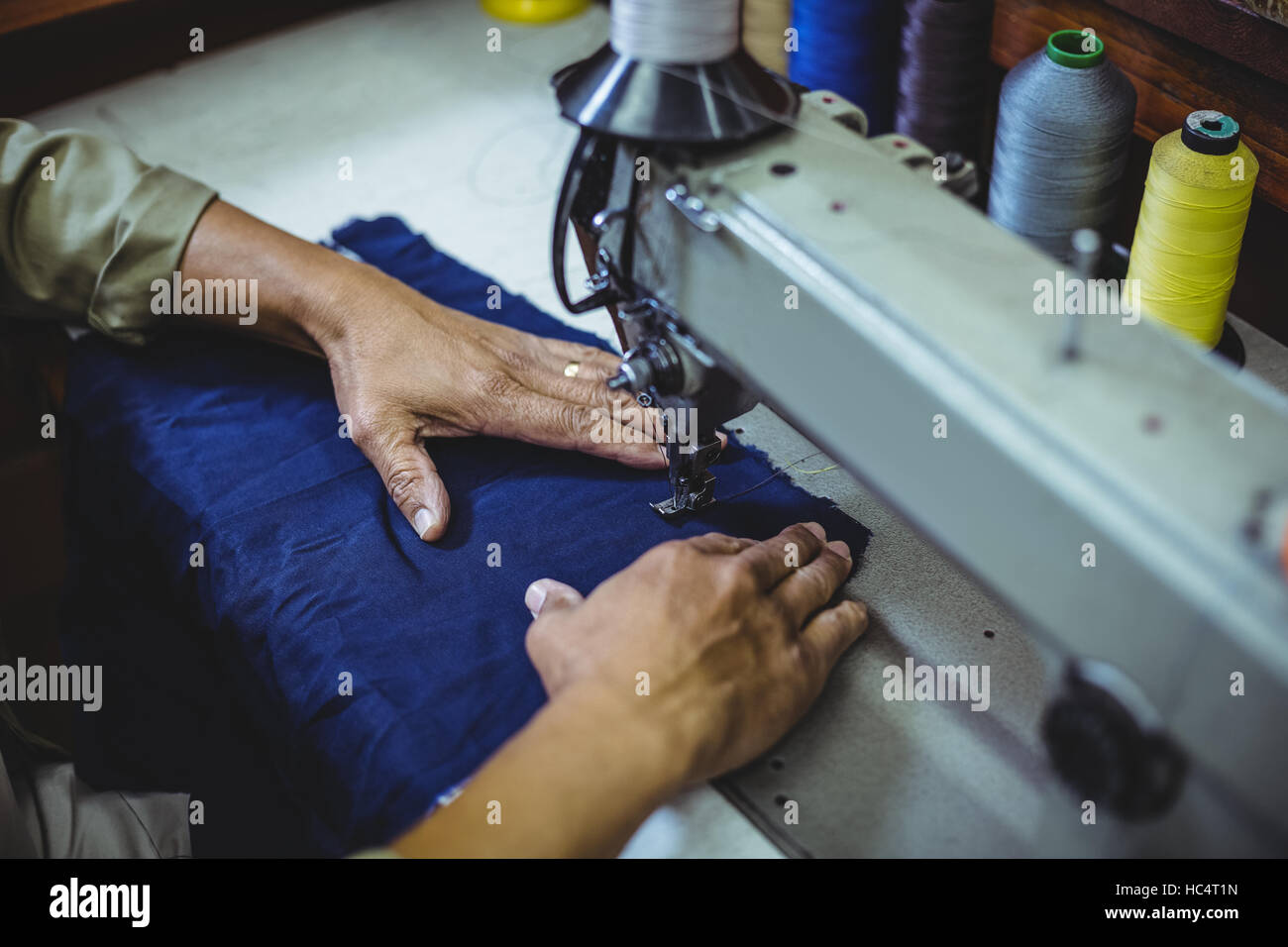 Shoemaker using sewing machine Stock Photo Alamy